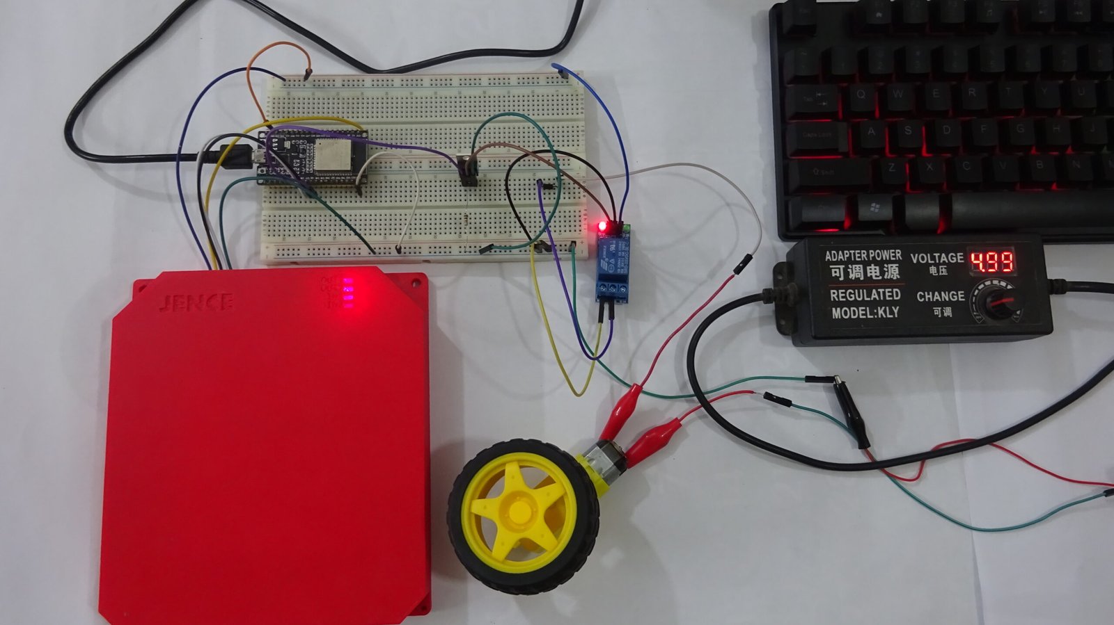 A 1280x720 landscape thumbnail for a DIY automatic gate opener project featuring the red JENCE J4220U UHF RFID reader, an ESP32 microcontroller, and a 14ft long-range detection circuit diagram.